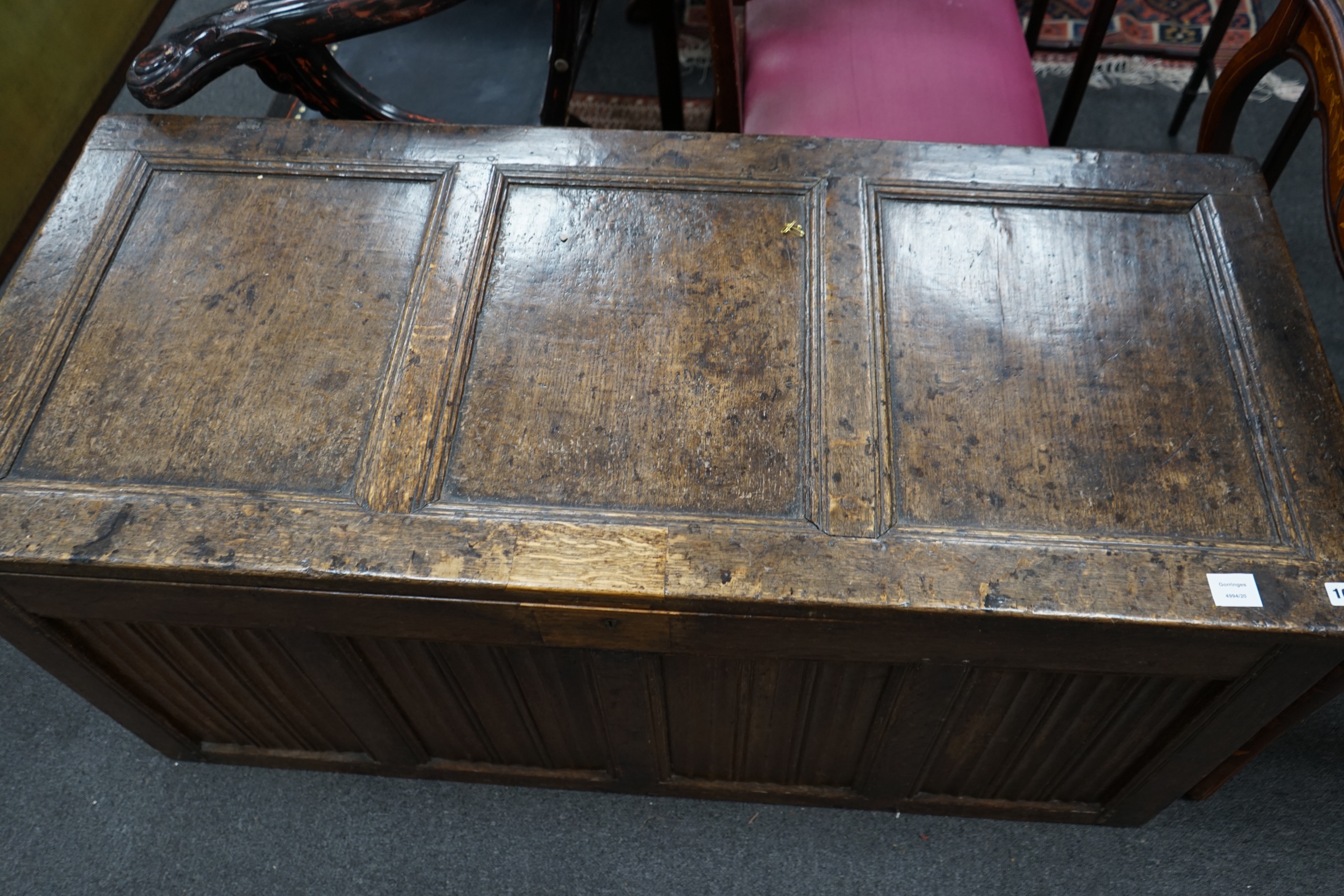 A 17th / 18th century panelled oak coffer, width 140cm depth 61cm height 62cm